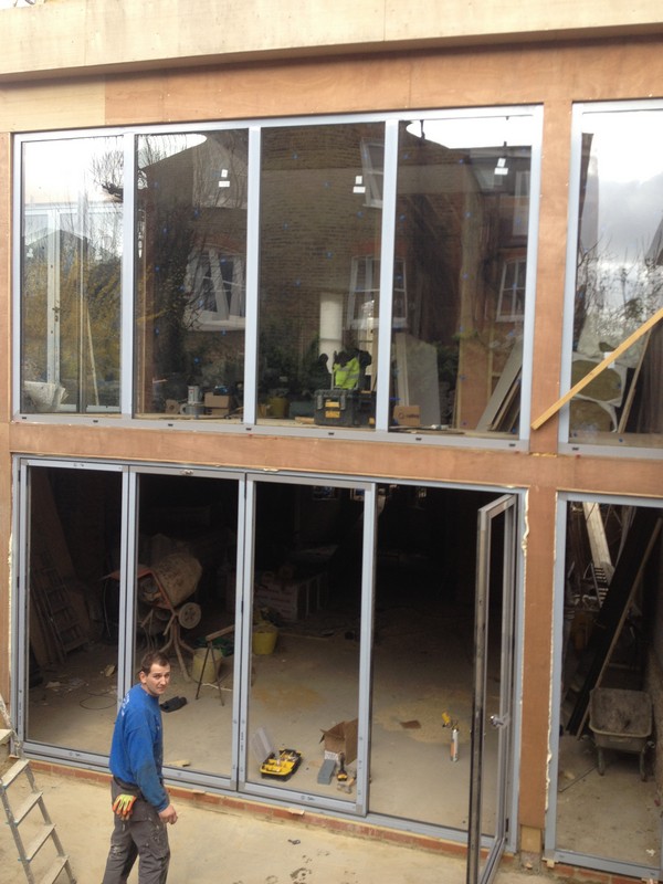 Aluminium bi-fold doors with two-storey glazing in Norbury