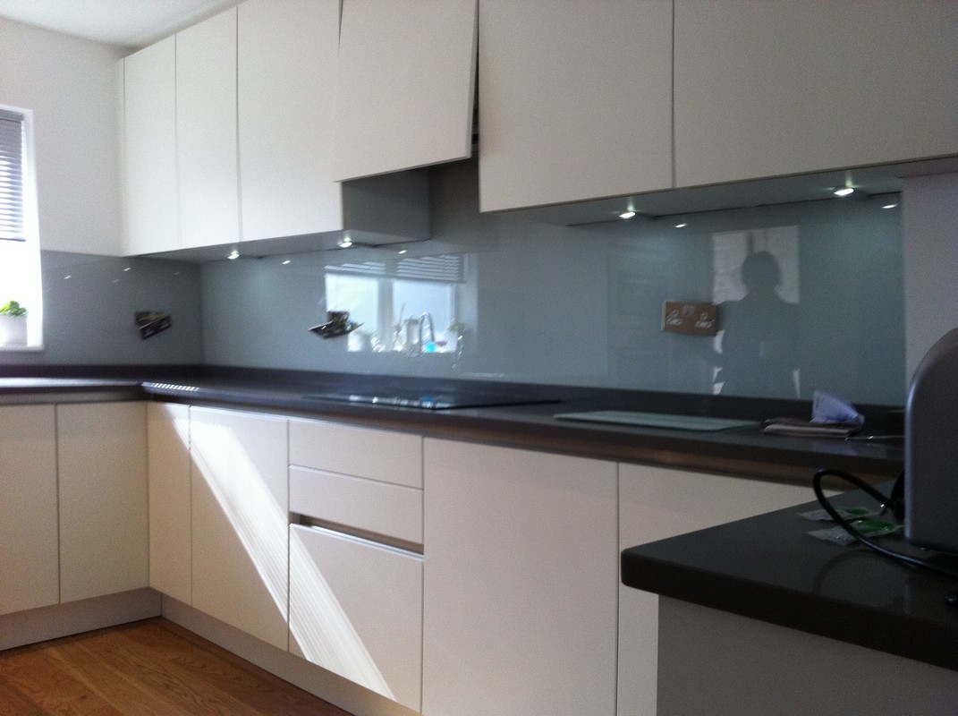 Grey glass kitchen splashback with LED lighting in Norbury