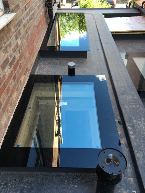 Multiple flat roof skylights on extension in Norbury